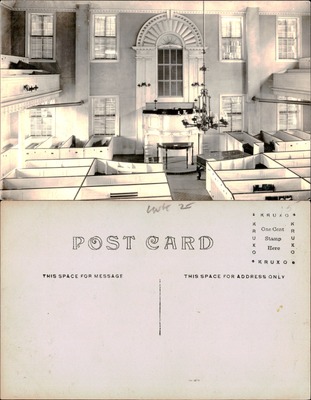 Interior of colonial meetinghouse or church with box pews and Palladian window