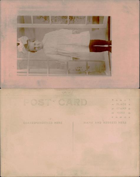 Young girl in white dress by window